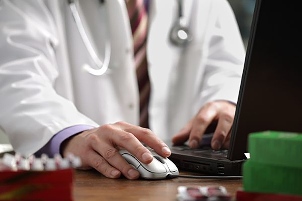 bigstock-Doctor-using-a-laptop-computer-16555088.jpeg